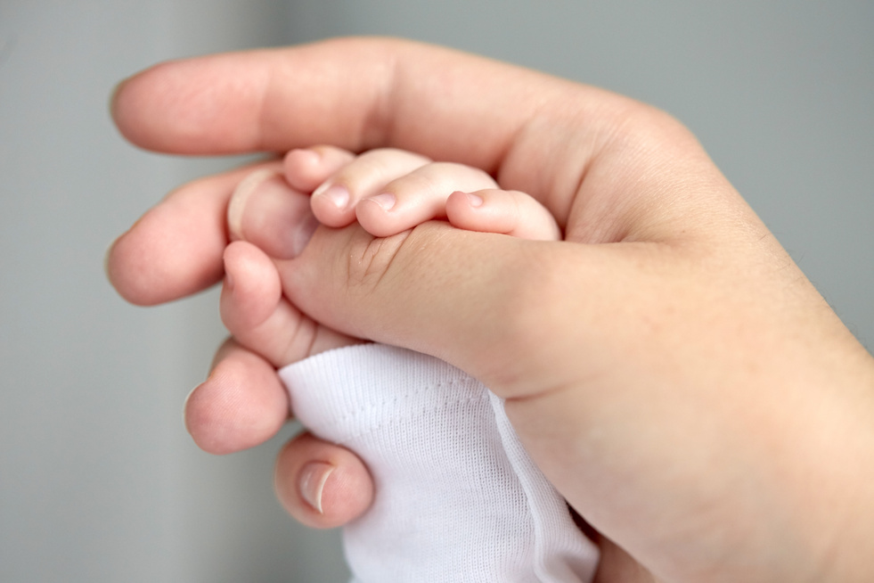 Mother and Newborn Baby Hands